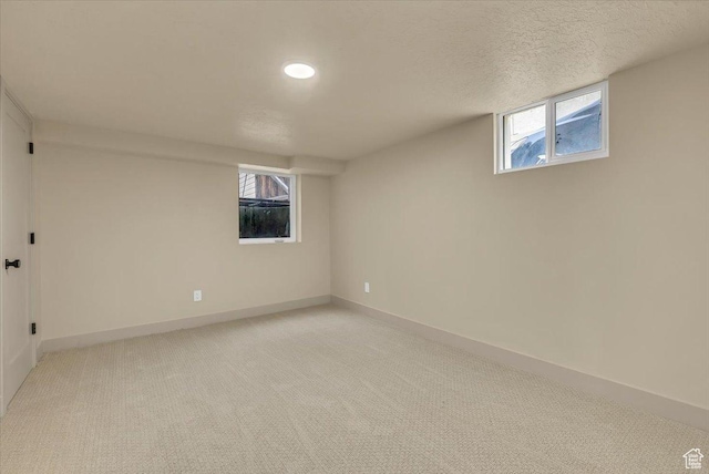 1662 E Browning Ave, Salt Lake City, UT 84105 - below grade area with recessed lighting, light colored carpet, a textured ceiling, and baseboards