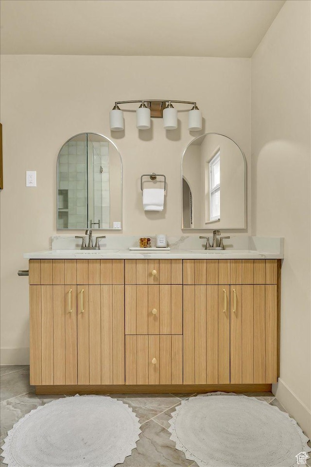 1662 E Browning Ave, Salt Lake City, UT 84105 - full bathroom with double vanity, baseboards, and a sink