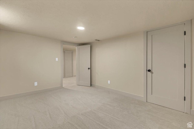 1662 E Browning Ave, Salt Lake City, UT 84105 - spare room featuring a textured ceiling, visible vents, baseboards, and light carpet