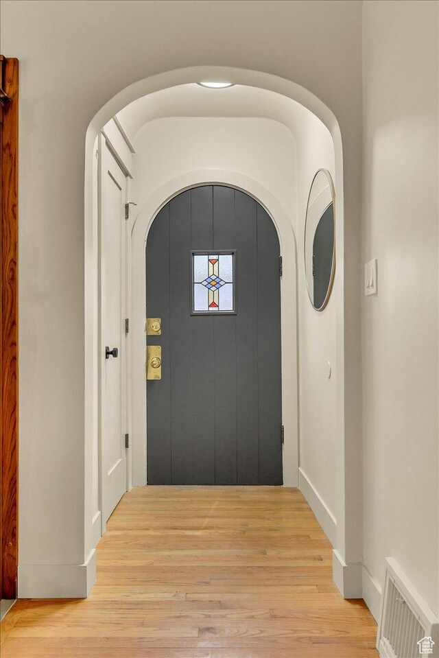 1662 E Browning Ave, Salt Lake City, UT 84105 - interior space with light wood finished floors, visible vents, and arched walkways