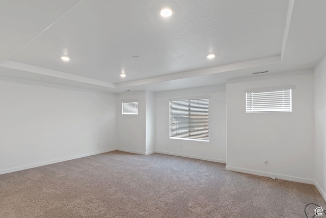 2256 E Emerald Ave Unit 208, Eagle Mountain, UT 84005 - empty room featuring recessed lighting, a tray ceiling, baseboards, and light colored carpet