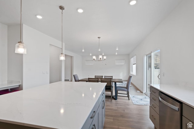 2256 E Emerald Ave Unit 208, Eagle Mountain, UT 84005 - kitchen featuring decorative light fixtures, a kitchen island, wood finished floors, recessed lighting, and dishwasher