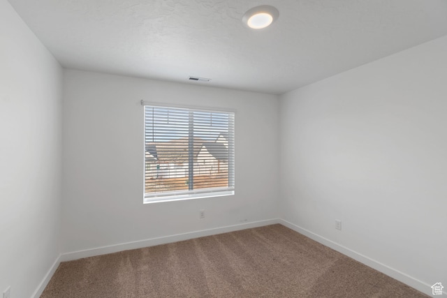 2256 E Emerald Ave Unit 208, Eagle Mountain, UT 84005 - spare room featuring visible vents, baseboards, and carpet floors