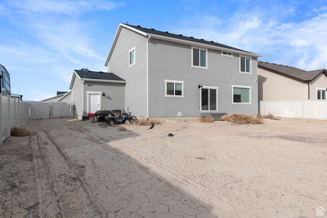 2256 E Emerald Ave Unit 208, Eagle Mountain, UT 84005 - rear view of property featuring a fenced backyard