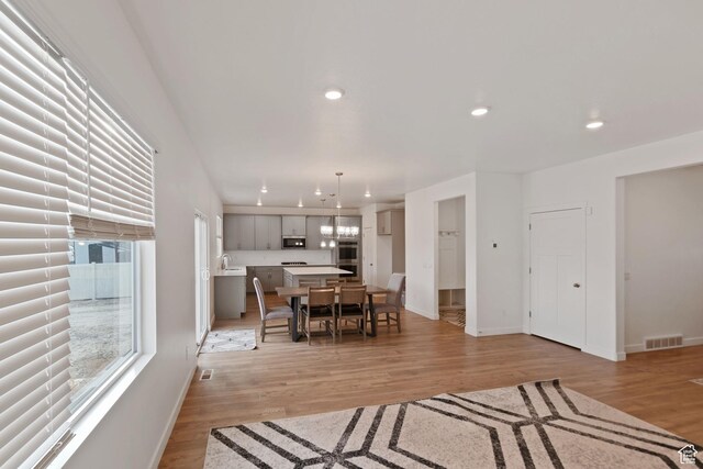 2256 E Emerald Ave Unit 208, Eagle Mountain, UT 84005 - dining room with recessed lighting, visible vents, baseboards, and light wood-style floors