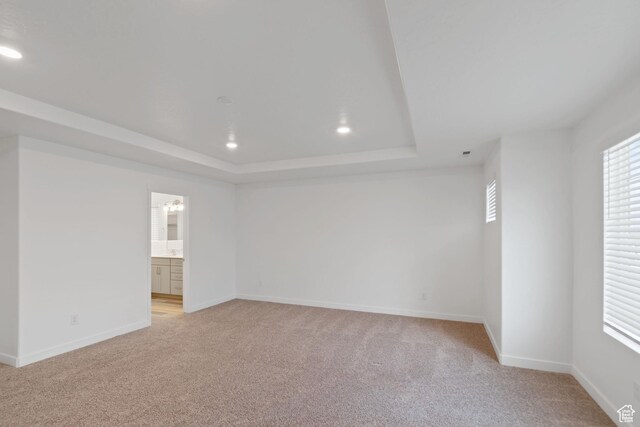2256 E Emerald Ave Unit 208, Eagle Mountain, UT 84005 - unfurnished room featuring light carpet, recessed lighting, baseboards, and a tray ceiling