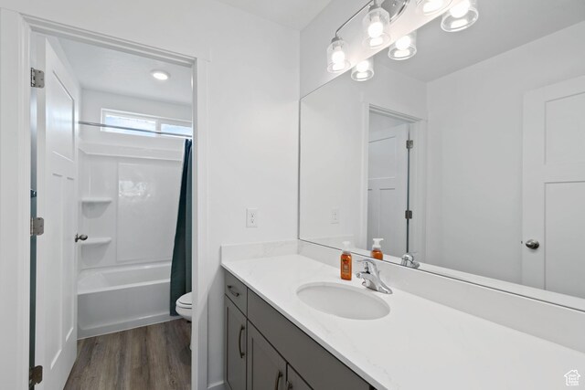 2256 E Emerald Ave Unit 208, Eagle Mountain, UT 84005 - full bathroom with toilet, shower / bath combo, wood finished floors, and vanity