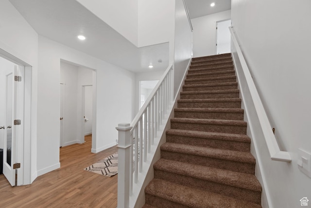2256 E Emerald Ave Unit 208, Eagle Mountain, UT 84005 - stairway featuring recessed lighting, baseboards, and wood finished floors