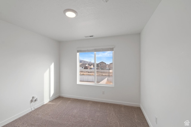 2256 E Emerald Ave Unit 208, Eagle Mountain, UT 84005 - carpeted empty room with visible vents and baseboards