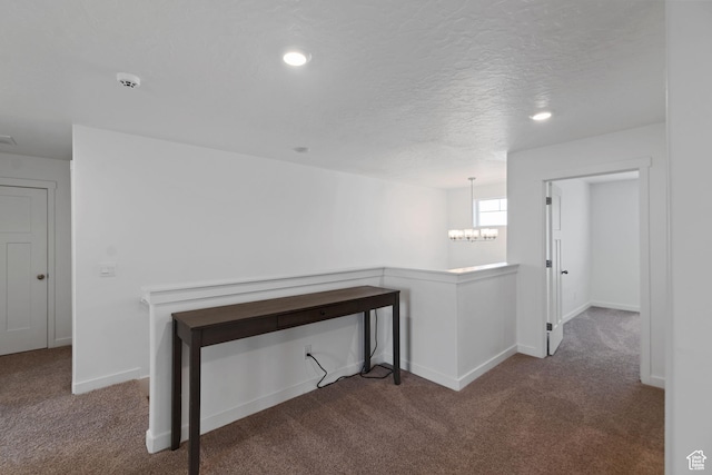 2256 E Emerald Ave Unit 208, Eagle Mountain, UT 84005 - corridor featuring baseboards, carpet flooring, recessed lighting, a notable chandelier, and a textured ceiling