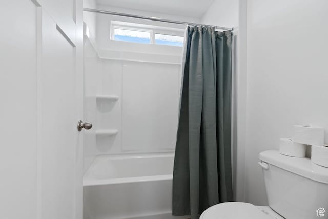 2256 E Emerald Ave Unit 208, Eagle Mountain, UT 84005 - bathroom with shower / bath combination with curtain and toilet
