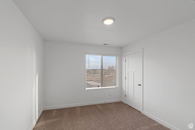 2256 E Emerald Ave Unit 208, Eagle Mountain, UT 84005 - carpeted spare room featuring baseboards