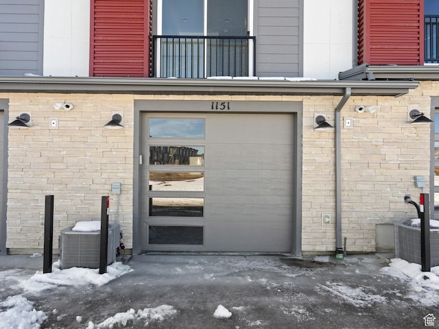 1151 Gambel Oak Way Unit 54, Park City, UT 84098 - snow covered property entrance with brick siding, a balcony, and a garage