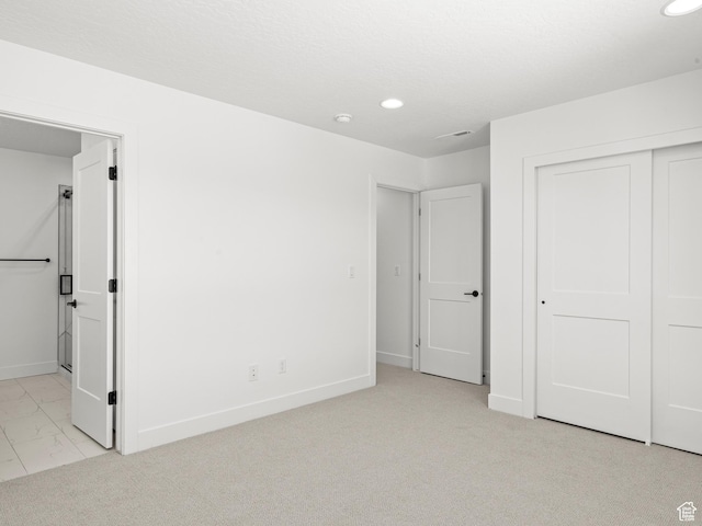1151 Gambel Oak Way Unit 54, Park City, UT 84098 - unfurnished bedroom featuring baseboards, ensuite bath, recessed lighting, a closet, and marble finish floor