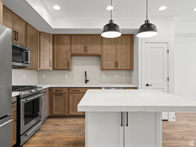 1151 Gambel Oak Way Unit 54, Park City, UT 84098 - kitchen with a sink, stainless steel appliances, tasteful backsplash, and light wood-style flooring