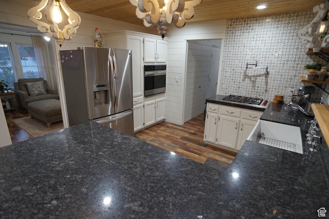 6835 S Larabrook Way, West Jordan, UT 84084 - kitchen featuring white cabinets, a notable chandelier, appliances with stainless steel finishes, and dark wood-type flooring