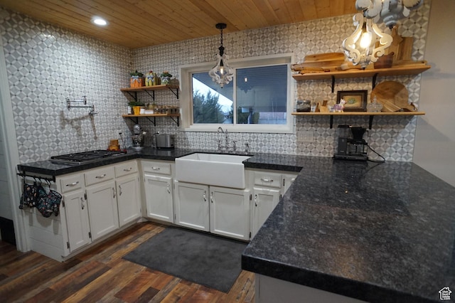 6835 S Larabrook Way, West Jordan, UT 84084 - kitchen featuring an inviting chandelier, open shelves, dark wood-style floors, a sink, and stainless steel gas stovetop