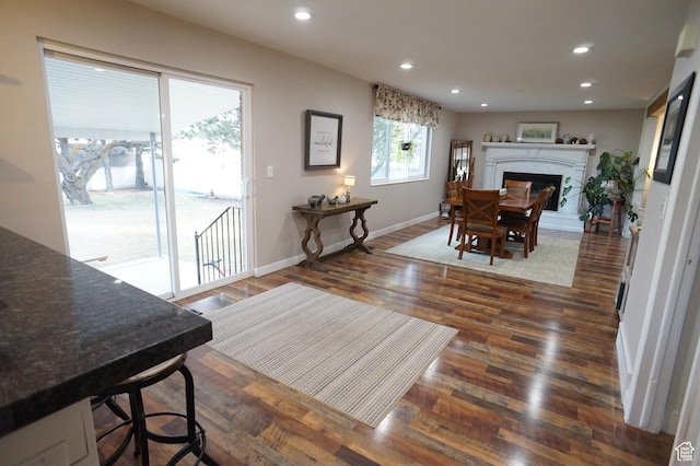 6835 S Larabrook Way, West Jordan, UT 84084 - dining room featuring recessed lighting, a fireplace with raised hearth, dark wood finished floors, and baseboards