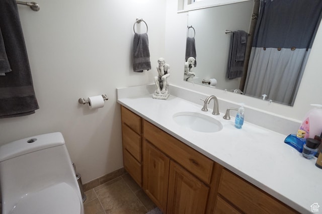 6835 S Larabrook Way, West Jordan, UT 84084 - bathroom featuring toilet, baseboards, tile patterned flooring, and vanity