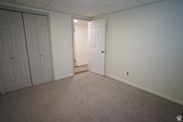 6835 S Larabrook Way, West Jordan, UT 84084 - unfurnished bedroom with baseboards, a drop ceiling, carpet, and a closet