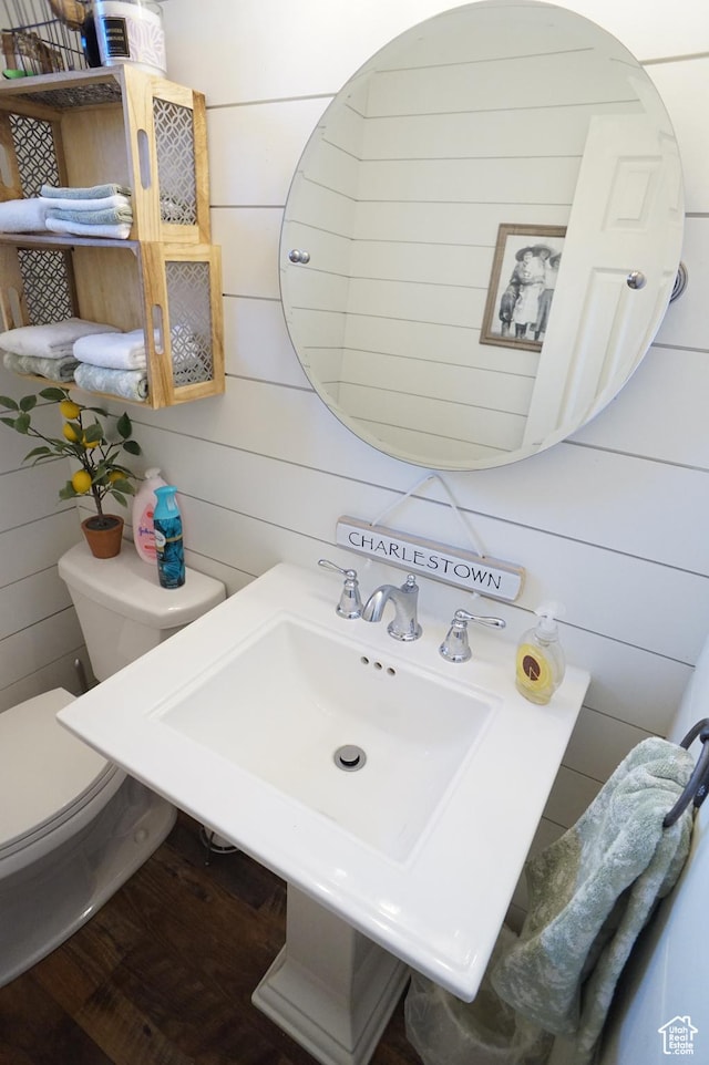 6835 S Larabrook Way, West Jordan, UT 84084 - bathroom with wood walls, wood finished floors, and toilet