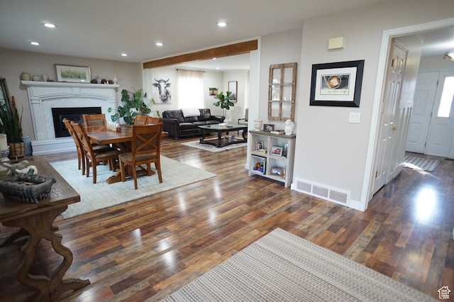 6835 S Larabrook Way, West Jordan, UT 84084 - dining area featuring visible vents, wood finished floors, baseboards, recessed lighting, and a fireplace with raised hearth