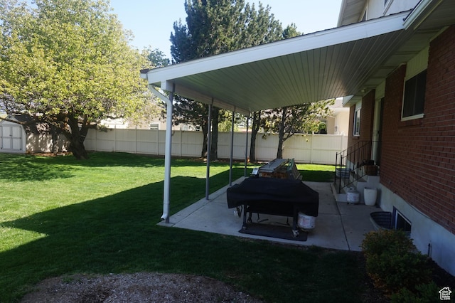 6835 S Larabrook Way, West Jordan, UT 84084 - view of yard featuring an outdoor structure, a patio area, fence, and a shed