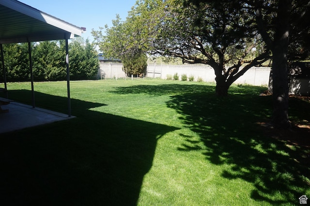 6835 S Larabrook Way, West Jordan, UT 84084 - view of yard featuring a fenced backyard and a patio area