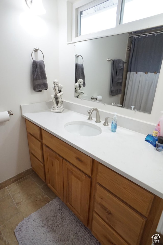 6835 S Larabrook Way, West Jordan, UT 84084 - full bathroom featuring vanity, baseboards, and curtained shower