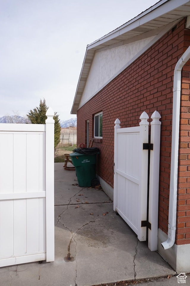 6835 S Larabrook Way, West Jordan, UT 84084 - view of property exterior featuring brick siding and fence