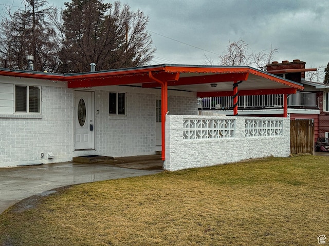1993 W 4200 S, Roy, UT 84067 - view of front of house featuring a carport, a front yard, and entry steps