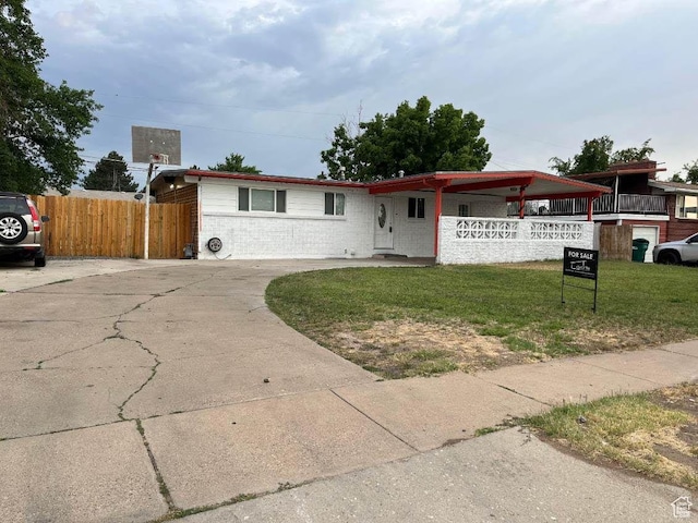1993 W 4200 S, Roy, UT 84067 - ranch-style home featuring brick siding, concrete driveway, and a porch