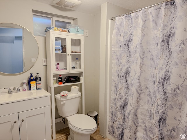 1993 W 4200 S, Roy, UT 84067 - full bath with vanity, a shower with curtain, toilet, and wood finished floors