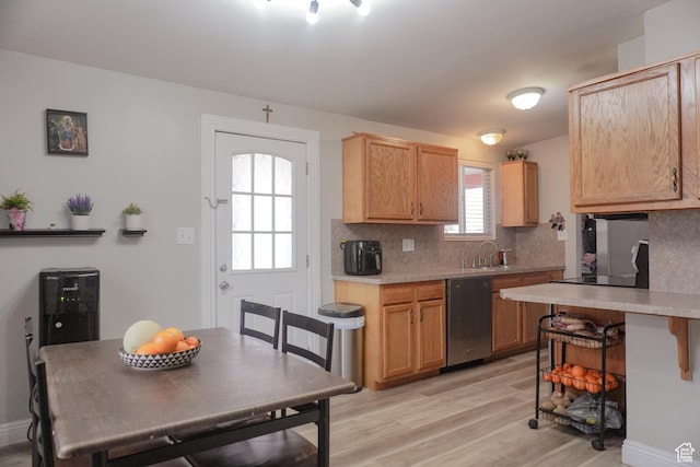 1993 W 4200 S, Roy, UT 84067 - kitchen with backsplash, dishwasher, light wood-type flooring, light countertops, and a sink