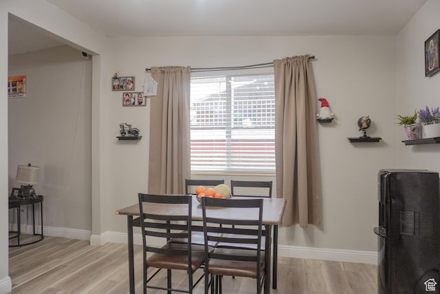 1993 W 4200 S, Roy, UT 84067 - dining area with light wood-type flooring and baseboards