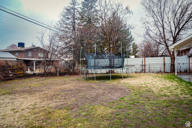 1993 W 4200 S, Roy, UT 84067 - view of yard with a trampoline and a fenced backyard