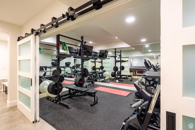 exercise room with recessed lighting