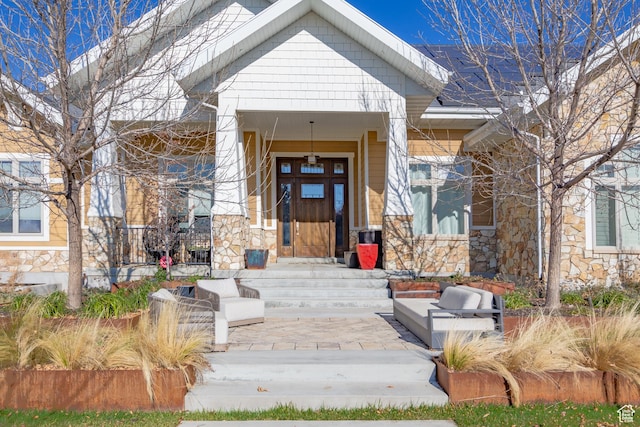 doorway to property featuring stone siding