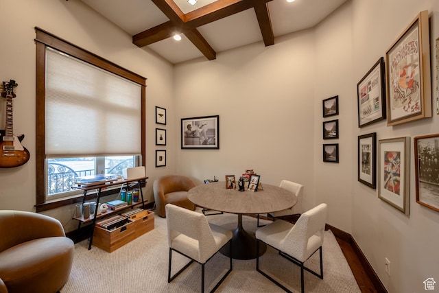 dining area with beam ceiling, coffered ceiling, and baseboards