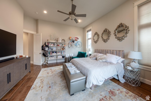 bedroom featuring a ceiling fan, recessed lighting, wood finished floors, and baseboards