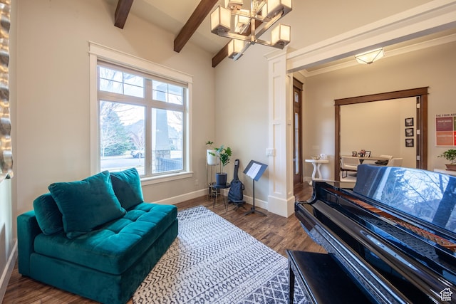 living area featuring dark wood finished floors, beamed ceiling, and baseboards