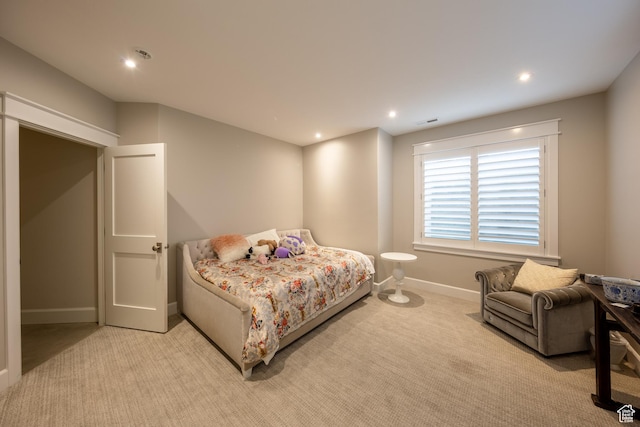 bedroom with light carpet, visible vents, recessed lighting, and baseboards