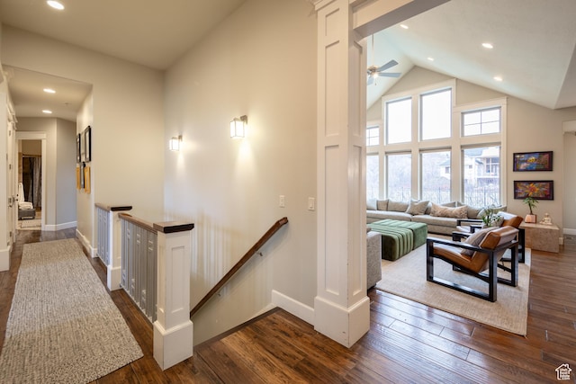 corridor featuring an upstairs landing, recessed lighting, and dark wood-type flooring