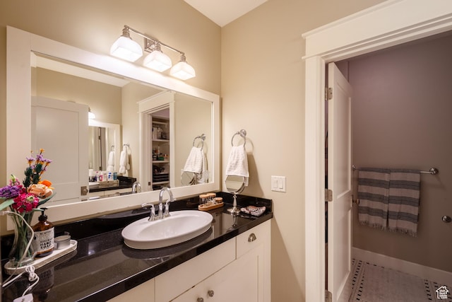 bathroom featuring vanity and baseboards