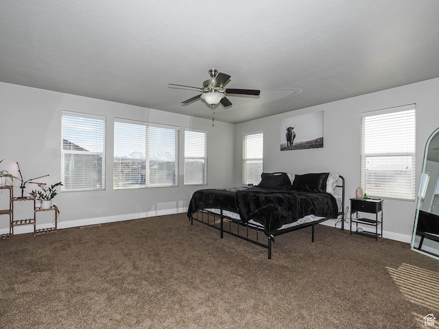3765 E Cunninghill Dr, Eagle Mountain, UT 84005 - bedroom with dark colored carpet, baseboards, and ceiling fan