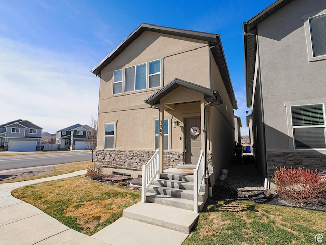 view of front of property with stucco siding and stone siding