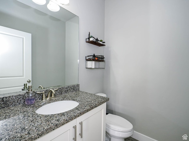 3765 E Cunninghill Dr, Eagle Mountain, UT 84005 - bathroom featuring baseboards, toilet, and vanity