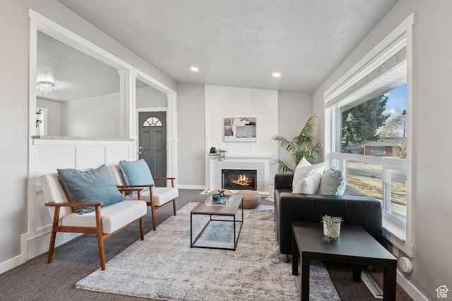 118 N Iowa Ave, Ogden, UT 84404 - carpeted living room featuring a high end fireplace, visible vents, recessed lighting, and baseboards
