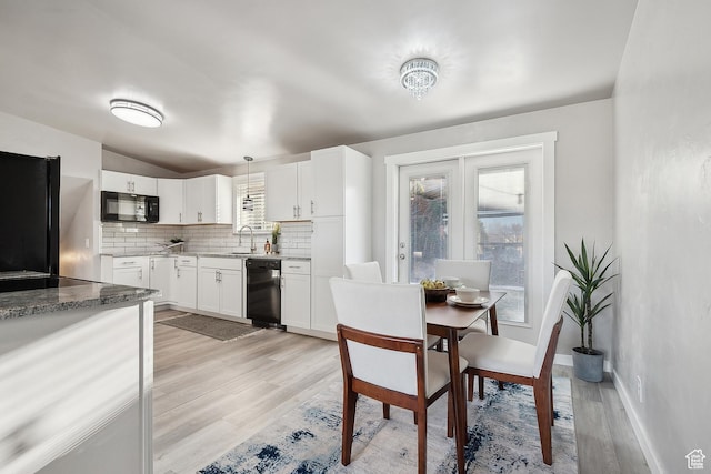 118 N Iowa Ave, Ogden, UT 84404 - dining space featuring light wood-type flooring, baseboards, and vaulted ceiling