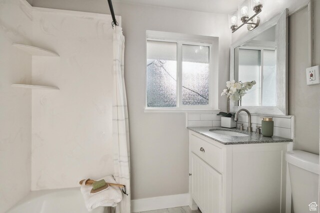 118 N Iowa Ave, Ogden, UT 84404 - bathroom with vanity, toilet, a shower with curtain, and baseboards
